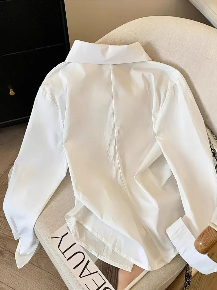 The Élisse Irregular Polo Blouse