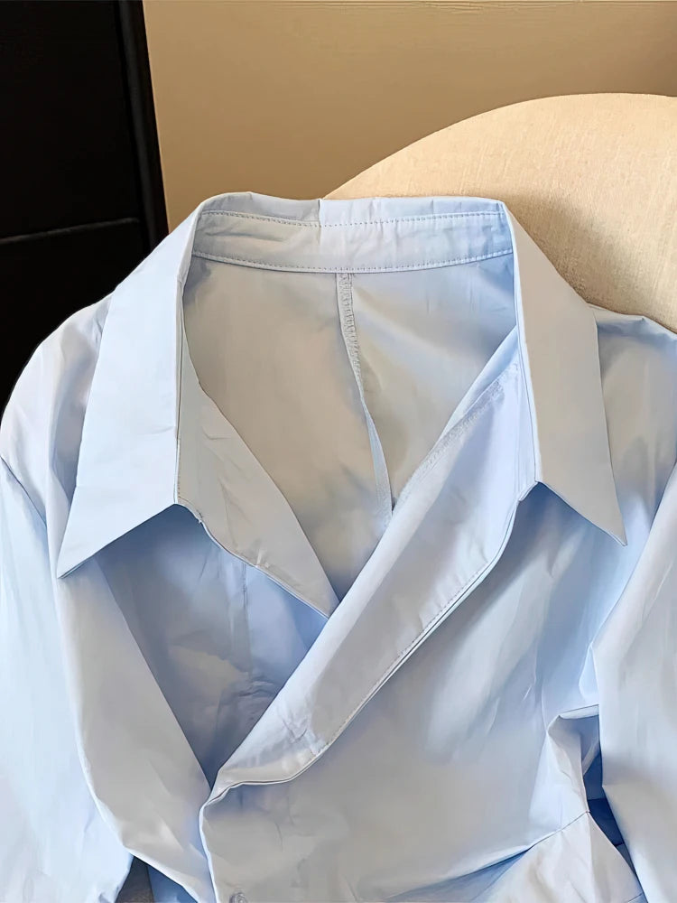 The Élisse Irregular Polo Blouse